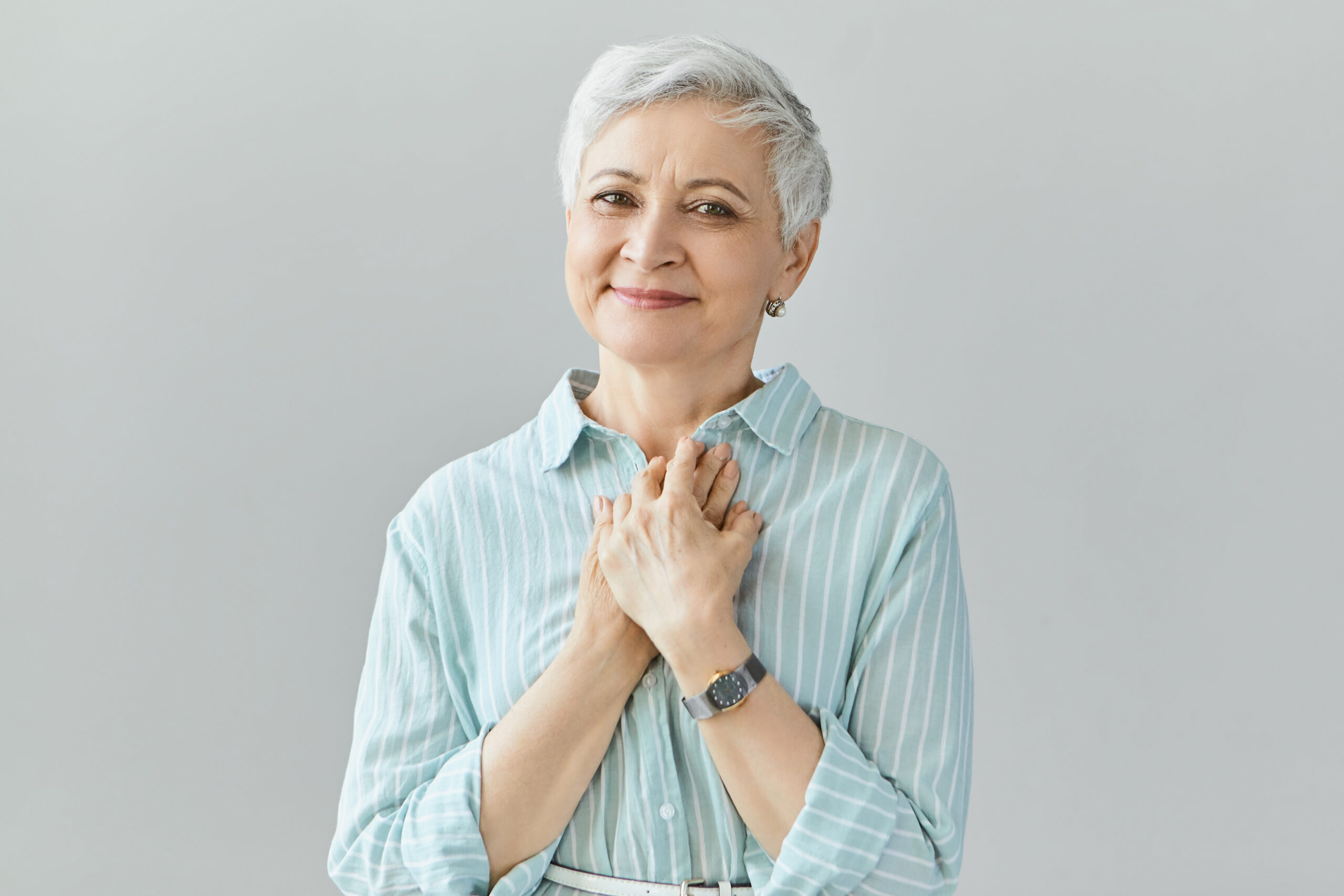 Beautiful friendly looking middle aged woman with sincere smile,